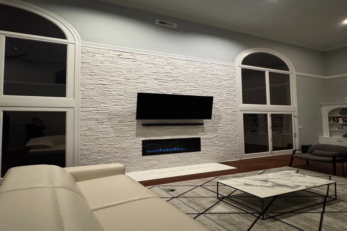 After: Elegant fireplace renovation with custom tile and stone work by Union County Contracting